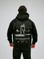 Svart hoodie med POWER-tryck och textdetaljer på ryggen